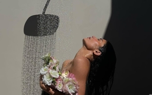 Kylie Jenner Covers Her Body With Flowers in Naked Shower Photo