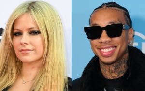 Avril Lavigne and Tyga Confirm Romance With a Kiss in Paris