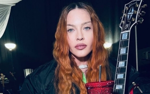 Madonna Confuses Fans by Licking a Guitar in New Bizarre Video 