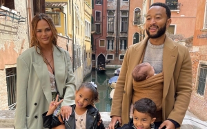 Chrissy Teigen Insists Daughter Esti Is 'Safe' in Defense of John Legend Using Baby Wrap