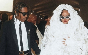 Rihanna Bares Baby Bump in Denim as She and A$AP Rocky Attend Pharrell's Paris Fashion Show