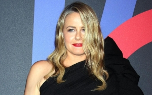 Alicia Silverstone Hilariously Struggles to 'Pull Through' as Her Huge Ball Gown Gets Stuck in Doorw