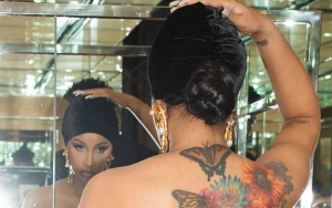 Cardi B Joins Busker for Impromptu Performance at Paris Fashion Week