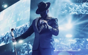 Watch Ne-Yo Hilariously Kick Out Fan for Taking His Hat Onstage in Viral Video