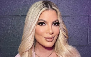 Tori Spelling Walks Around RV Campsite in Bathrobe