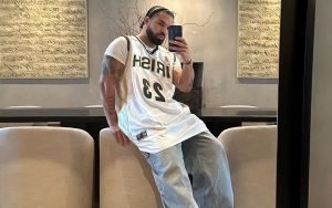 Drake Laughs Off 'For All the Dogs' Poster in Toronto