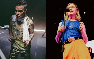 Robbie Williams and Take That Bandmate Mark Owen Reunite Onstage for 1st Time in 12 Years