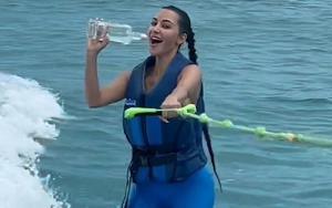 Kim Kardashian Hilariously Wipes Out on Wakeboard While Promoting Kendall Jenner's 818 Tequila