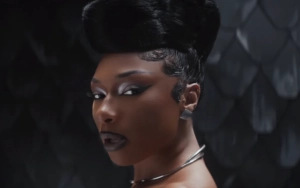 Megan Thee Stallion Crawls Out of Snake's Mouth in 'Cobra' Music Video