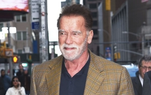 Arnold Schwarzenegger Goes for Bike Ride With Younger Woman Before Kissing Mystery Woman