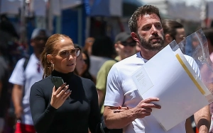 Jennifer Lopez Shows Off Hourglass Figure in Red Dress at Her and Ben Affleck's Christmas Bash