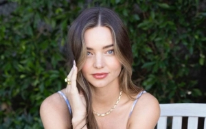 Miranda Kerr Flaunts Baby Bump in Stunning Red Dress for Christmas Eve