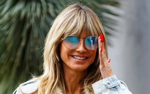 Heidi Klum Soaks Up the Sun Sans Top During Beach Day Out in New Video