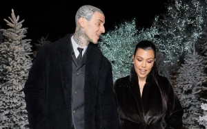 Kourtney Kardashian and Travis Barker Snuggle on a Snow Tube on Christmas Eve
