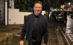 Hugh Jackman Hits the Beach in His Shorts on Freezing Day to Mark New Year
