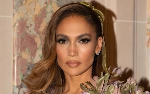 Jennifer Lopez Turns Heads in Dreamy Floral Cape Over Low-Cut Gown at Paris Fashion Week