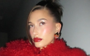 Hailey Bieber Showcases Curves in Wet White Dress in New Beach Photos