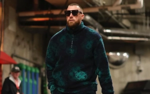 Travis Kelce Flashes Smile While Taking Selfie With Cop After Chiefs' Super Bowl Parade Shooting