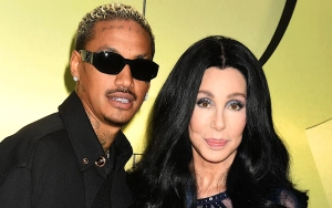 Cher Cozies Up to Boyfriend A.E. During Rare Appearance at Paris Fashion Week