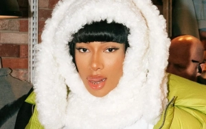 Megan Thee Stallion Strolls Around Japan in Abs-Baring Outfit