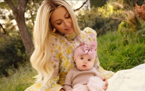 Paris Hilton Flashes Huge Smile in First Pictures With Baby Daughter London