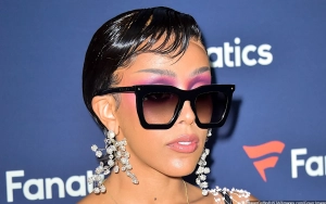 Doja Cat Holds Hands With Guram Gvasalia, Rocks Plastic Wrap Bandeau Dress