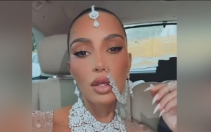 Kim Kardashian Opts for Neutral Color on Day 2 at Billionaire's Wedding After Eye-Catching Red Dress
