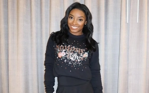 Simone Biles Celebrates Sixth Olympic Gold Medal in Paris With Bedazzled G.O.A.T. Necklace