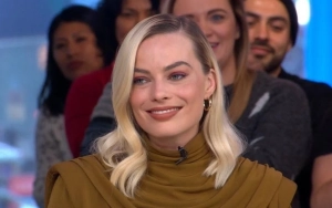 Margot Robbie Flaunts Pregnancy Curves in Black Bikini During Italian Getaway