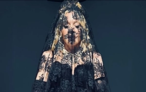 Madonna Covered Up From Head to Toe in Black Veil at Dolce and Gabbana Show in Milan