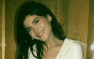 Kylie Jenner Shows Off Enviable Figure in Revealing Dress in New Photos