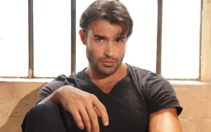 Sam Asghari Shields New Girlfriend From Paparazzo at LAX