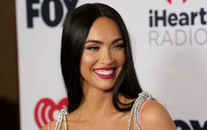 Pregnant Megan Fox Showcases Growing Baby Bump in Daring Dress 