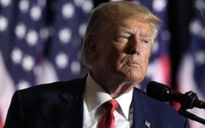 Donald Trump Glares at Journalist After Being Hit in the Face With Microphone 