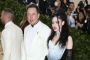 Grimes Confirms She's 'Still Living' With Elon Musk After Trolling Paparazzi With Karl Marx's Book