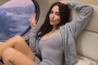 Kim Kardashian Breaks Into Fit of Giggles Over Her 'Threesome' Joke