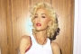 Gwen Stefani Uses Tabloid Newspaper to Decorate Her Bathroom