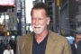 Arnold Schwarzenegger Goes for Bike Ride With Younger Woman Before Kissing Mystery Woman