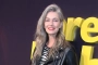 Paulina Porizkova Trades Top for Silver Paint in Daring New Photo