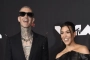 Travis Barker Comments on Leaked Pics of His and Kourtney Kardashian's Baby Son Rocky