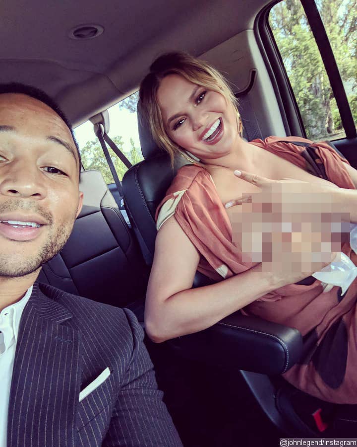 Chrissy Teigen pumping breast milk in a snap.