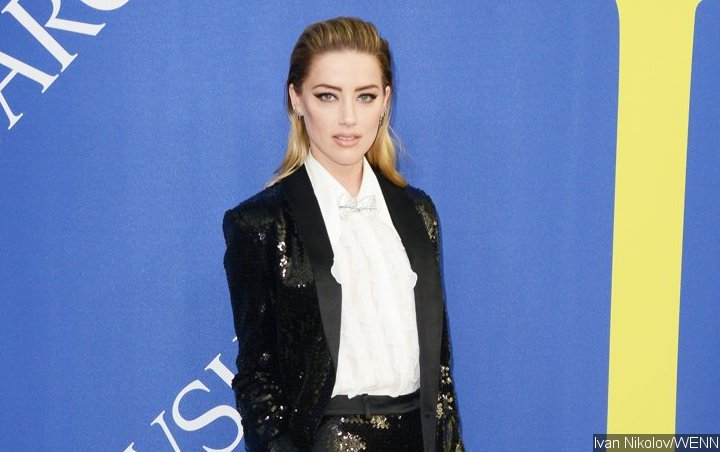 Amber Heard Under Fire for Racist Tweet About Illegal 