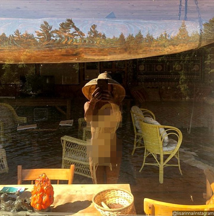 Lisa Rinna goes completely naked for a window selfie in her 55th birthday