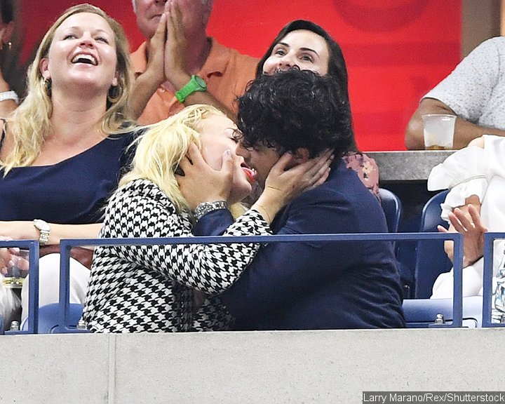 Sophie Turner and Joe Jonas pack on PDA.