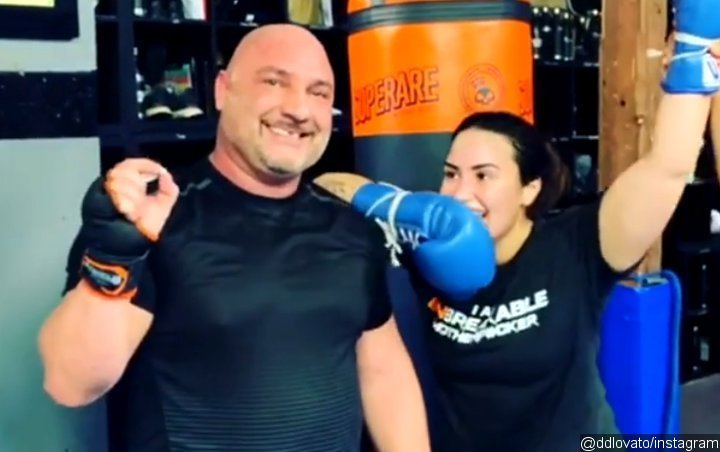 Demi Lovato's Trainer Trolls Her for Boasting About Knocking His Tooth Out