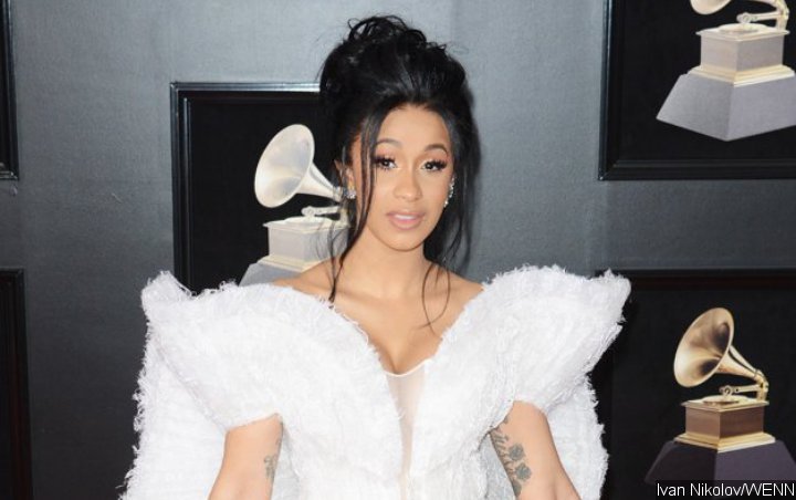 Cardi B Fiercely Claps Back at Hater Accusing Her of Using Ghostwriters