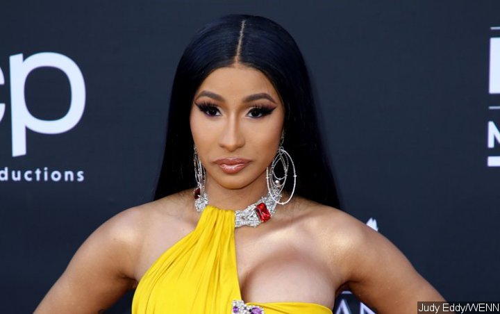 Cardi B Delivers Sexy Bathrobe Performance At Bonnaroo After