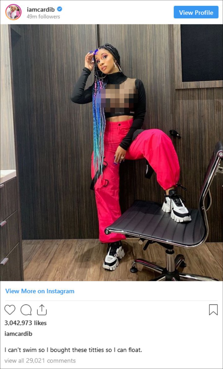 Cardi B Jokes About Her Breast Implants as She Proudly Displays Boobs