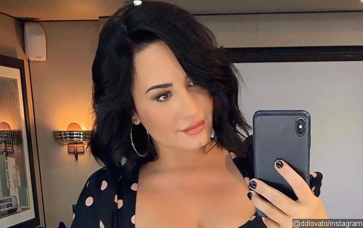 Demi Lovato Gives Fans Minor Heart Attack With Photo of Her Cradling 'Baby Bump'