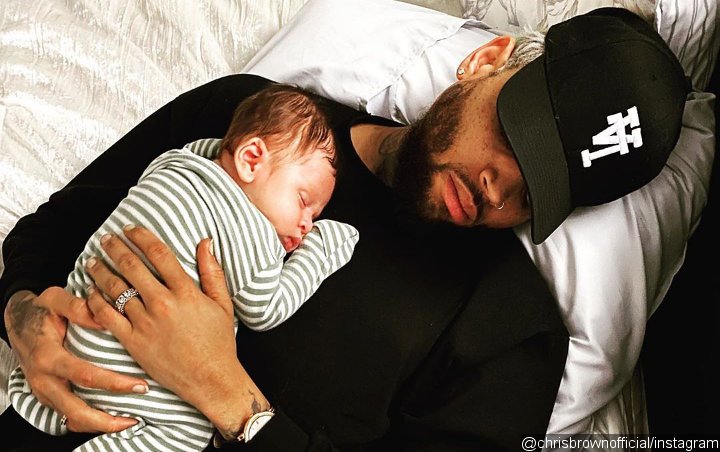 Chris Brown Debuts New Hand Tattoo Inspired by His Son Aeko Chris Brown Debuts New Hand Tattoo Inspired by His Son Aeko
